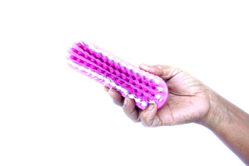 Close up hand hold brush for scrub dirty cloth, isolated on white background. Concept, equipment for washing, scrubbing and cleaning dirty cloth, carpet or surface. Daily chores tool.        