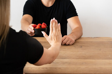 Woman Avoiding Strawberries: Food Allergies, Food Intolerances, Fruit Avoidance, Intermittent Fasting, Snack-Free Days, Putting an End to Snacking