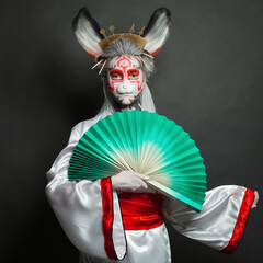 Fashion portrait of stylish woman with Halloween makeup on black background