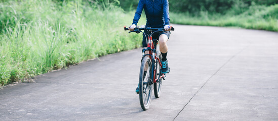 Naklejka premium Riding bike in spring forest