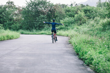 Obraz premium Riding bike in summer forest