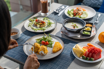 eating delicious breakfast at restaurant
