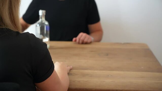 woman, refusing alcohol, not drinking vodka, alcohol-free New Year's Eve, NOLO, abstinence, tackling alcohol issues, saying no to drinks at social gatherings, giving up substances, battling addictions