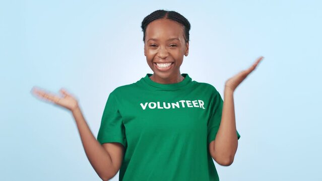 Black Woman, Face And Volunteer With Hand Pointing In Studio For How To, Guide Or Choice On Blue Background. NGO, Presentation And Portrait Of African Female Activist Show Charity, Donation Or Steps