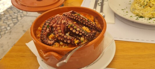 A plate of rice with octopus, a delightful seafood dish.