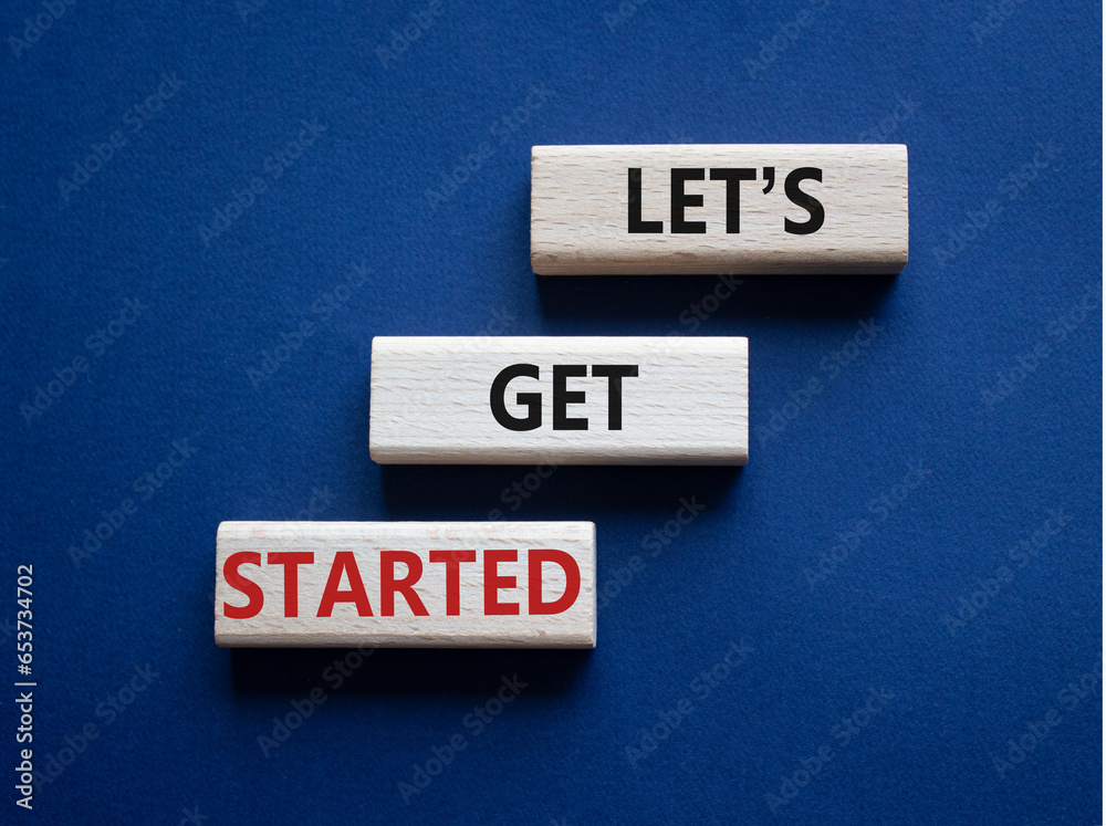 Canvas Prints lets get started symbol. concept words lets get started on wooden blocks. beautiful deep blue backgr