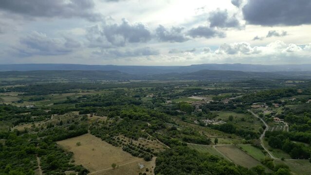 Aerial Panorama between Vaugines and Cucuron: Cloudy Skies Over Ancient and New Forests in PACA, Provence &ndash; A Drone&rsquo;s View