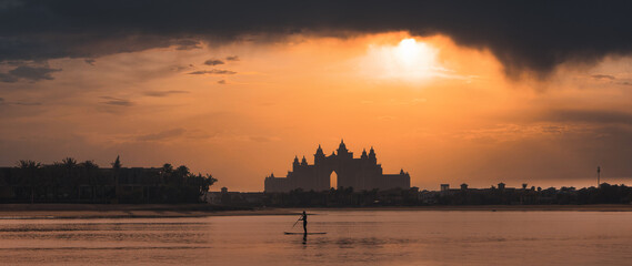 water boarding during sunset with Atlantis the Palm view. High quality photo