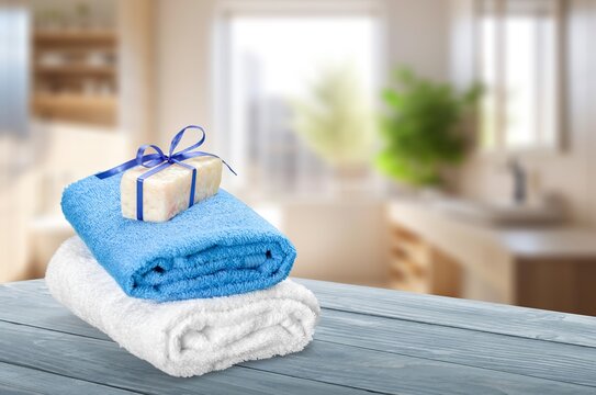 fresh clean soft towels on desk in bathroom, AI generated image