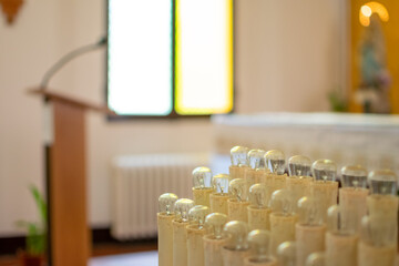 Candles of supplication and wishes on altar of Church with background of lectern