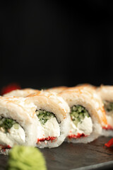 Close-up of king prawn sushi on a black background. Japanese restaurant menu sushi