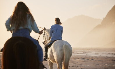 Woman, horse riding and activity at beach, together and back view for exercise, wellness or health. Female, person or friends with workout on vacation, holiday and traveling at sunset for self care
