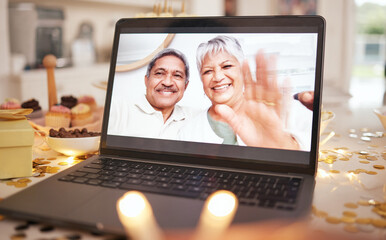 Senior couple, laptop screen and video call on table at party, event or dinner by candle, glitter...