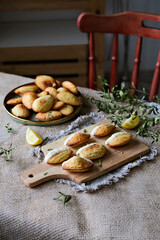 Fototapeta na wymiar Freshly baked madeleine cake. Madeleines with glaze. French sponge biscuits