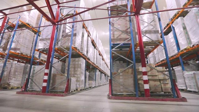 Frozen storage warehouse. The camera moves through the factory warehouse. Modern warehouse, industrial interior