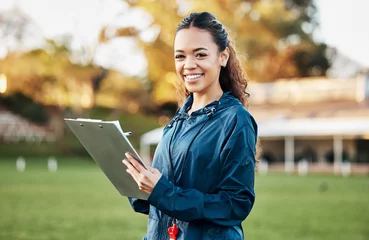Fotobehang Persoonlijk Coach, sports and portrait of woman with clipboard on field for training, planning and game strategy. Happy, writing and personal trainer outdoors for exercise, workout schedule and fitness routine  © Talia Mdlungu/peopleimages.com