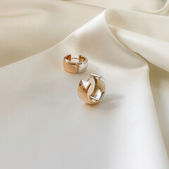 Stylish earrings in 14k pink gold on plaster mold.