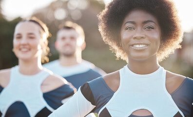 Smile, fitness and a cheerleader group outdoor together for support, motivation or competition in summer. Face, health and wellness with a sports team at an event in a park or on a field of grass
