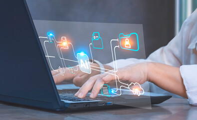 Fototapeta premium Businesswoman hands using Laptop on office desk with Document Management System (DMS) Virtual screen with AI technology to manage files efficiently, conveniently, quickly and securely