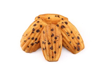 Madeleine cookies with chocolate chips on white background.