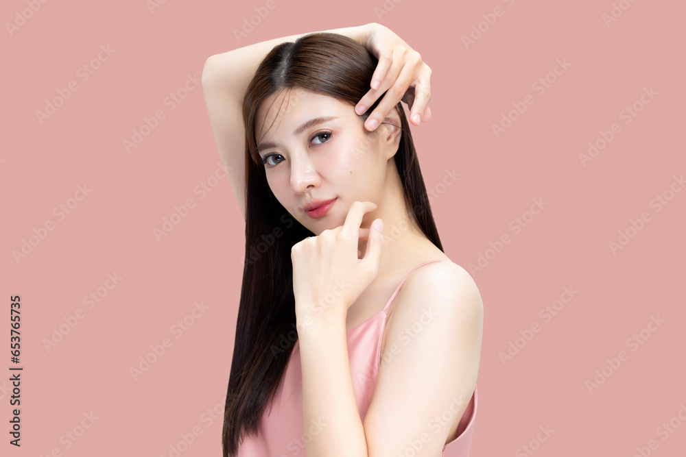 Poster Portrait beauty Asian woman with K-beauty make up showing fresh and clean skin isolated on pink background. Skin care and cosmetology concept.