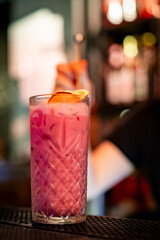 woman hand bartender making cocktail in glass on the bar counter