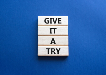 Give it a try symbol. Concept words Give it a try on wooden blocks. Beautiful deep blue background. Business and Give it a try concept. Copy space.