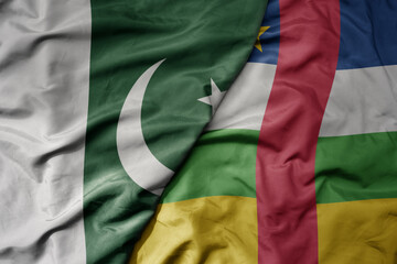 big waving realistic national colorful flag of pakistan and national flag of central african republic .