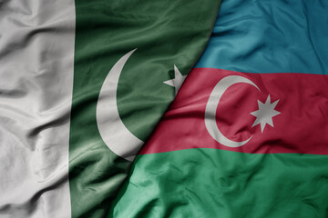 big waving realistic national colorful flag of pakistan and national flag of azerbaijan .