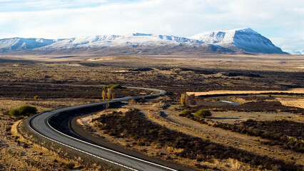Patagonia Argentina. Famous road at town of El Calafate at Patagonia Argentina. Patagonia road landscape. Amazing landscape of desert scenery with nevada mountain. El Calafate at Patagonia Argentina. - obrazy, fototapety, plakaty