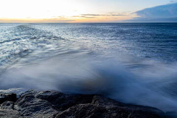 Waves hitting rock long exposure