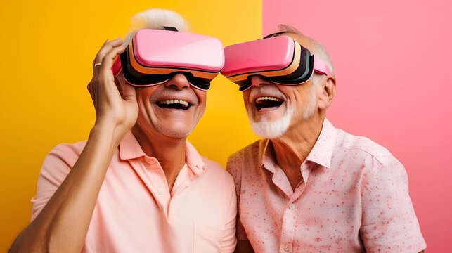 Senior adult couple having fun together with virtual reality headsets sitting on the couch.Concept of New trends and technology concept