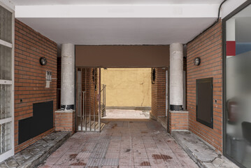 Entrance portal to a building with a passageway and carriage access