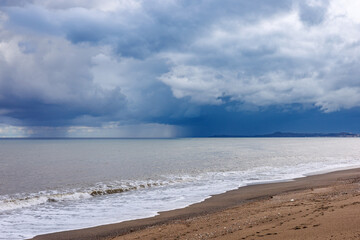 Evening after a stormy rain on the beach of the island of Sicily