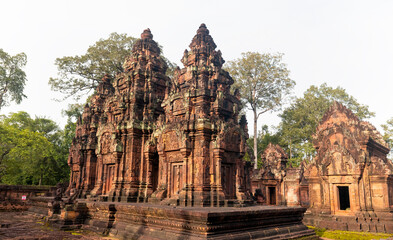 Banteay Srei Hindu temple dedicated to Shiva. The temple built in red sandstone was rediscovered 1814 in the jungle of the Angkor wat complex area of Cambodia. - obrazy, fototapety, plakaty