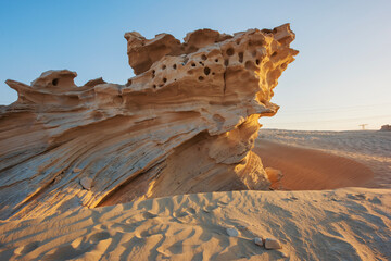 Desert eroded rock pattern with clear sky during the hot sun. Desert rock formation with erosion.