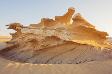Desert eroded rock pattern with clear sky during the hot sun. Desert rock formation with erosion.