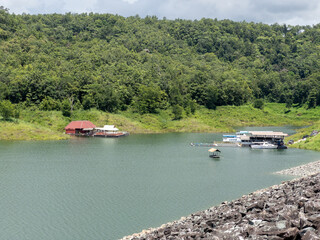The ferry boat and floating restaurant for travel in the large reservoir.