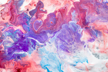 Abstract paint mixture with random pattern, red, blue, purple and white, fluid trails, soft focus...