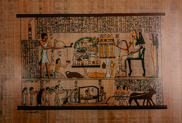 Drawing of ancient Egyptian rituals on papyrus paper. Photograph.
