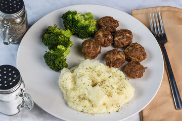 meat ball with broccoli and mashed potatoes