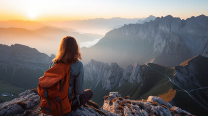 Hipster young girl with backpack enjoying sunset on peak of foggy mountain. Tourist traveler on background view mockup. Hiker looking sunlight in trip in Spain country, mock up text. - obrazy, fototapety, plakaty