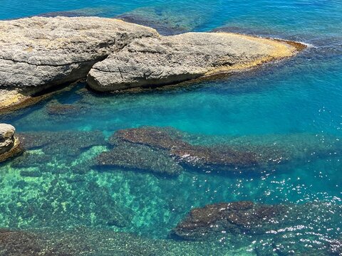 Sea clear blue turquoise and rocky coast aerial view 