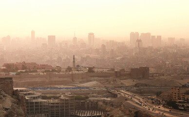 Fototapeta na wymiar Aerial panoramic view of dusty Cairo at sunset. Most populated and largest cities of the world 