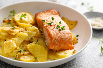 Salmon grilled and baked potato with onions