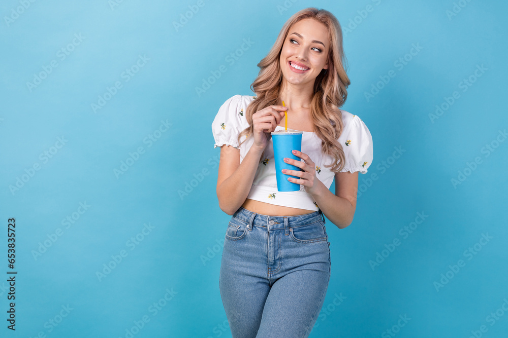 Poster Photo of positive charming lady wear white blouse drinking soda smiling isolated blue color background