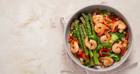 Stir fried shrimps with asparagus, vegetables. Cooked healthy food.