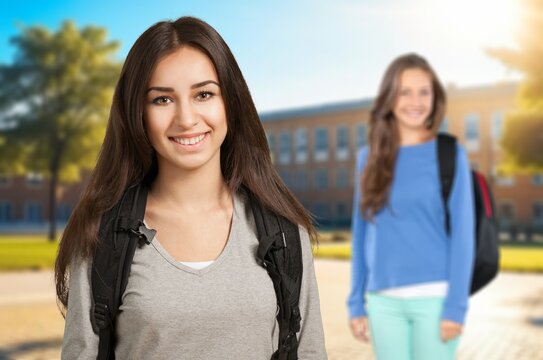Two happy University Students smiling outdoors at the campus, AI generated image