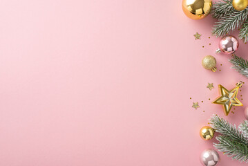 Glitzy seasonal setup. Overhead image of adorable pink and gold tree baubles, star, shimmering sequins, confetti, frost-kissed fir twigs on pastel pink surface with space for greetings or advertising