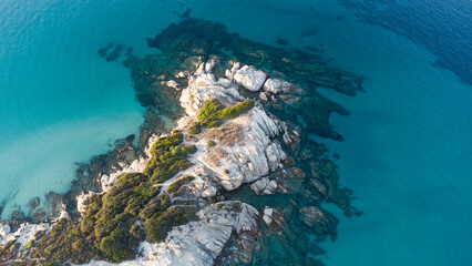 Aerial drone view of rocks, water and forest near the twin beaches of Karidi and small Karidi, Vourvourou, Sithonia peninsula, Halkidiki, North Greece